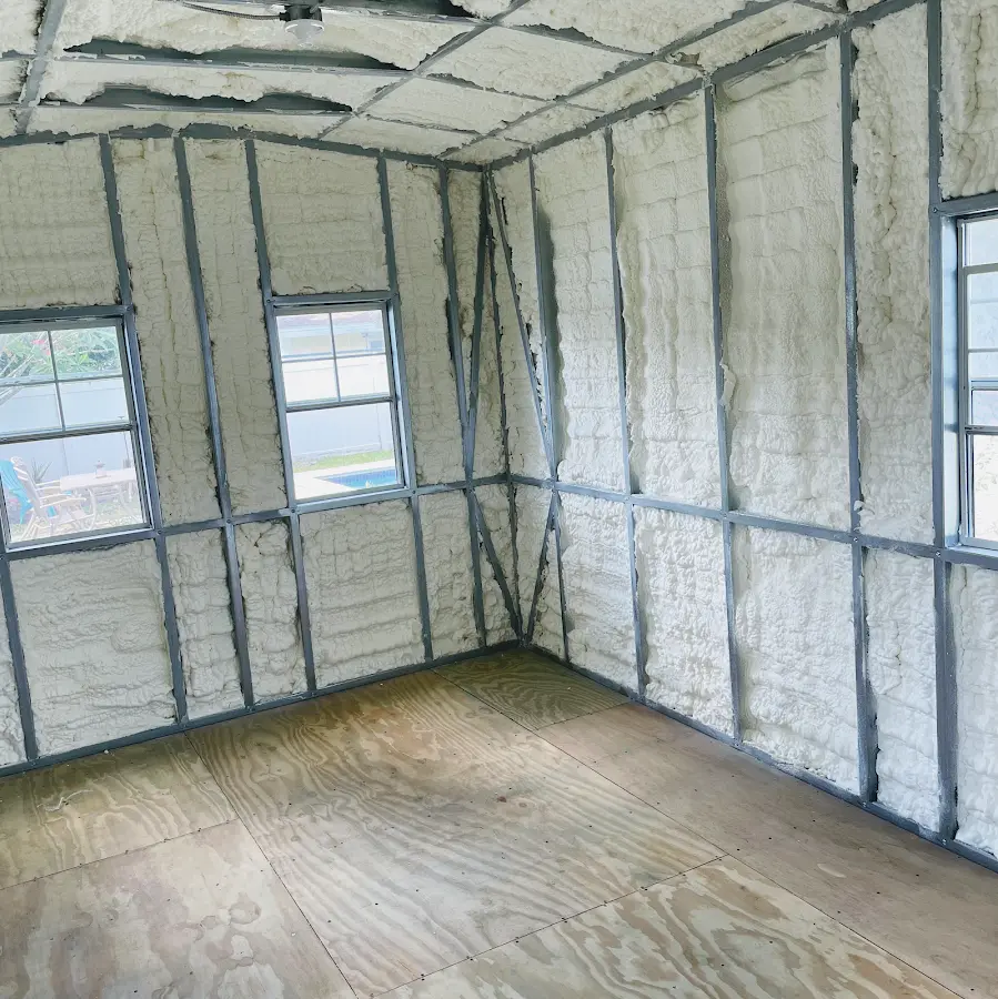 Closed-cell spray foam insulation applied to wall cavities in a residential project in Porterville